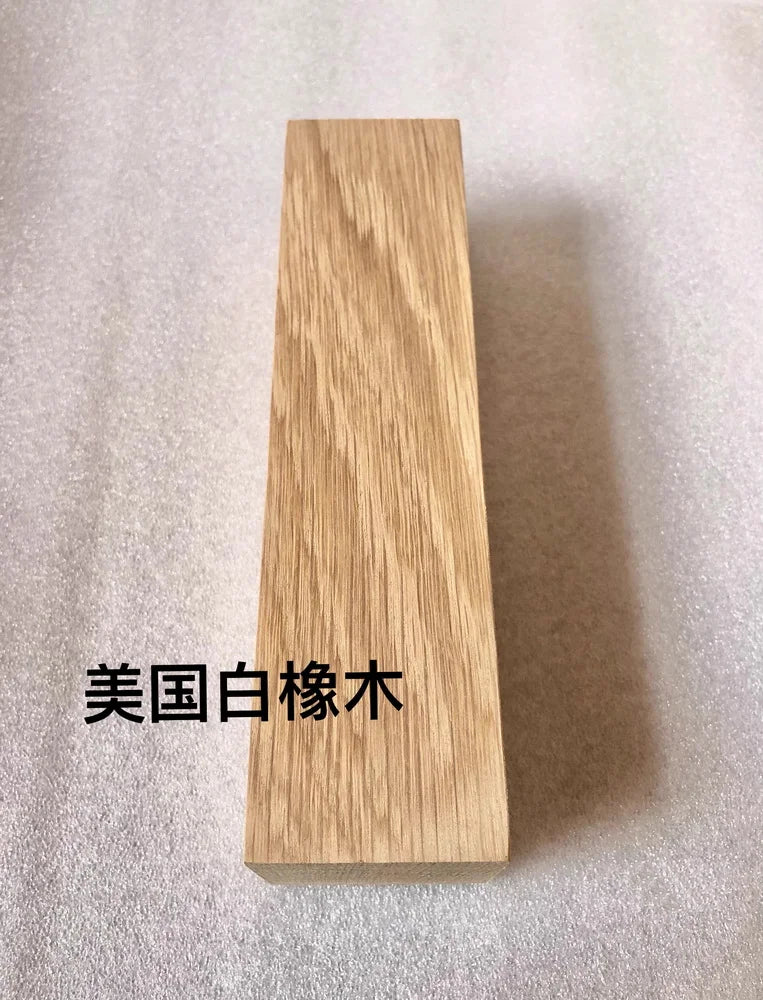 A vertical rectangular block of light-colored natural wood, likely used as a blank for knife handles or DIY projects.