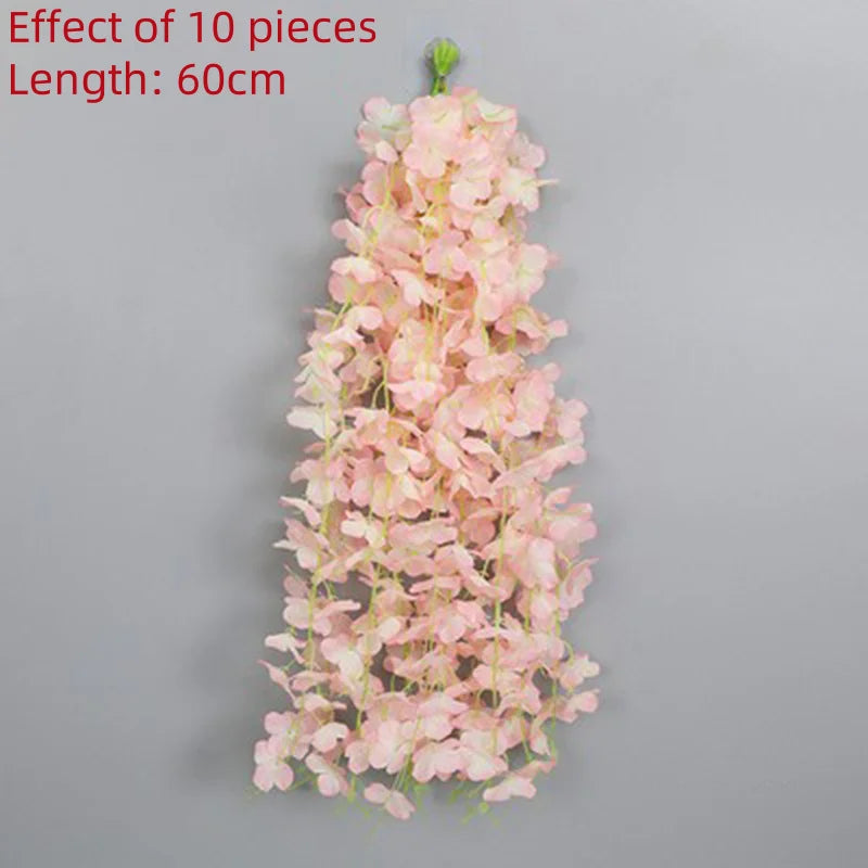A long, cascading garland of pink artificial wisteria flowers, 60cm in length.
