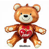A golden teddy bear balloon with a red heart design and foil finish.