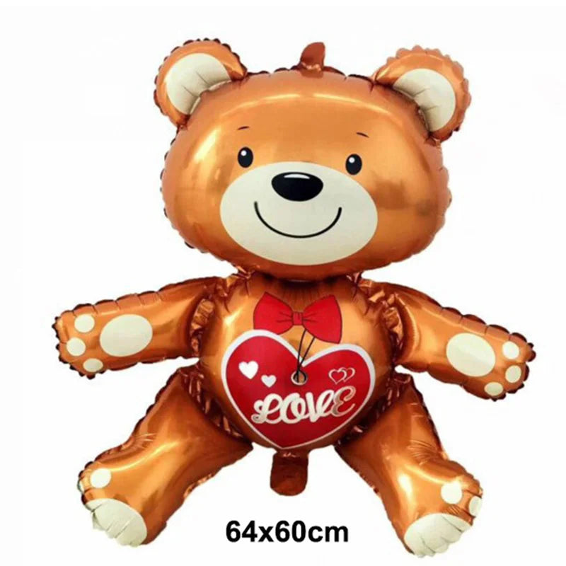 A golden teddy bear balloon with a red heart design and foil finish.