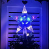 A glowing blue and purple star shaped LED Christmas tree topper displayed against a dark background.
