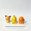 A set of six yellow and orange portable soft squeeze decorations or mini figurines displayed on a white background.