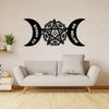 Black metal wall art featuring a pentagram design with crescent moon shapes above and below