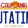 A vintage metal wall sign for Outatime featuring the California state flag design and text.