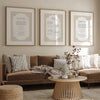 A gallery wall featuring framed Islamic calligraphy prints of Ayatul Kursi, 4 Quls, and Surah Al-Fatiha on a neutral wall.