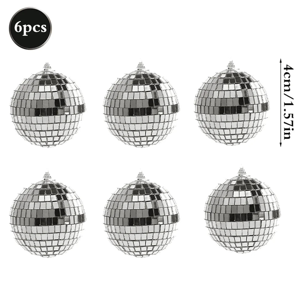 Six pieces of silver disco mirror balls used for parties and decor.