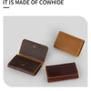 A set of brown leather card holders and cable organizers displayed on a light gray background.