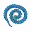 A blue articulated snake desk toy made of flexible, textured material coiled in a spiral.