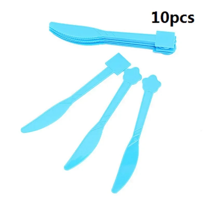A set of 10 light blue flag pulling cake toppers and tableware for a Minecraft-themed party.