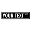 A black rectangular sign with the text YOUR TEXT in white, featuring a small word TEXT below it.