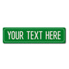 A rectangular green sign with the text YOUR TEXT HERE, designed for a custom metal street sign.