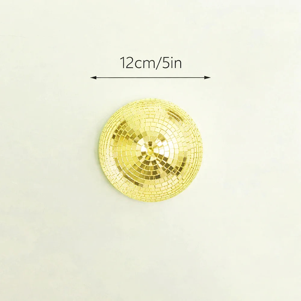A round, gold disco ball made of mirrored tiles, measuring 12cm/5in.