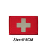 Red tactical morale patch with a silver cross symbol