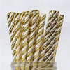 A bundle of gold and white striped paper drinking straws