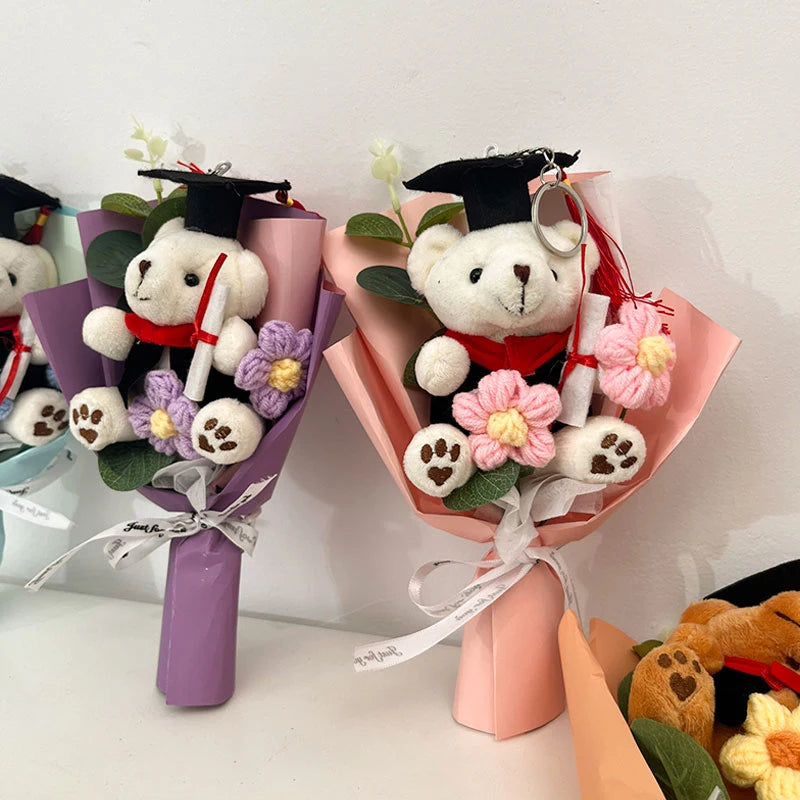 A handcrafted crochet flower bouquet featuring a teddy bear wearing a graduation cap and gown.