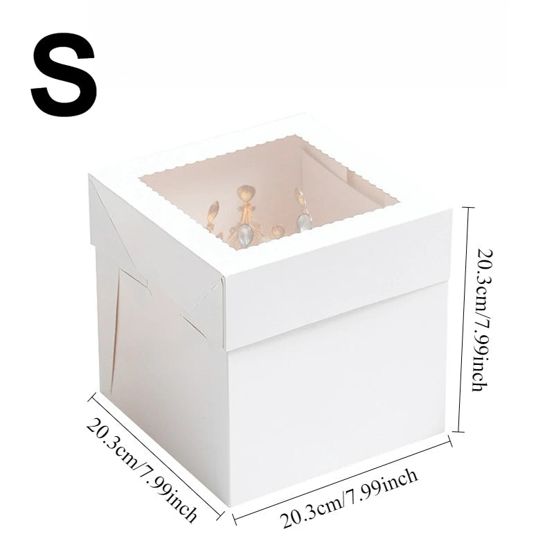 A white bakery box with a window is shown, featuring a large letter S on the top left.