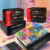 A set of 366 acrylic paint markers in various shades displayed on a pink surface.