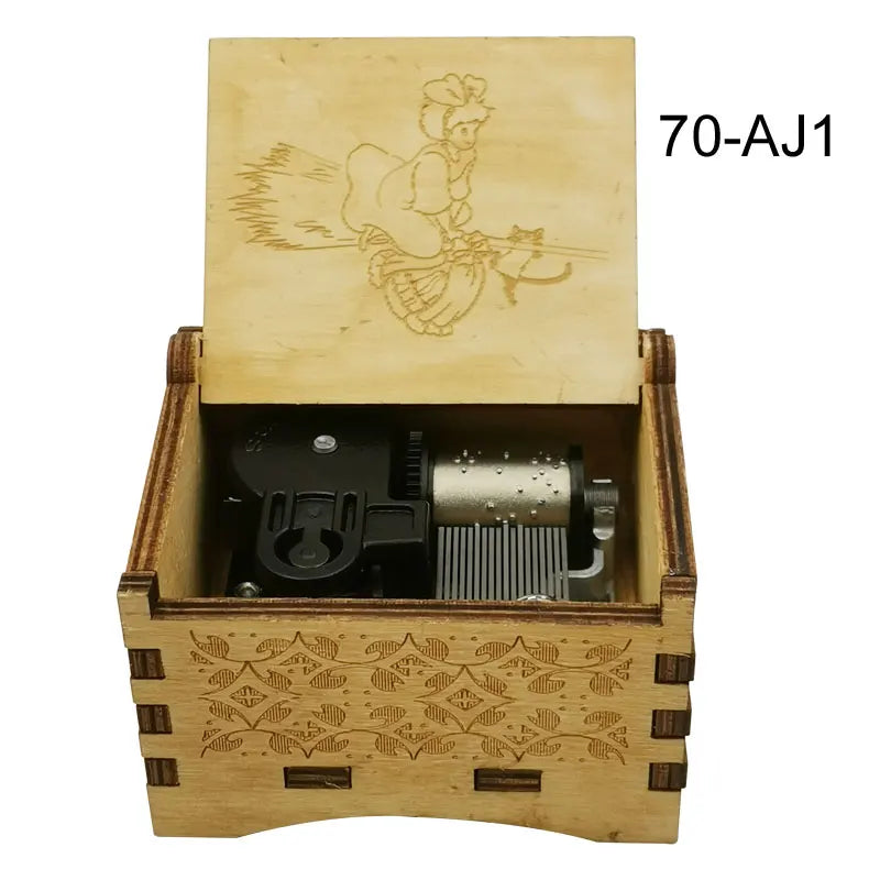 A wooden music box with a lid featuring an anime character and an internal mechanism.
