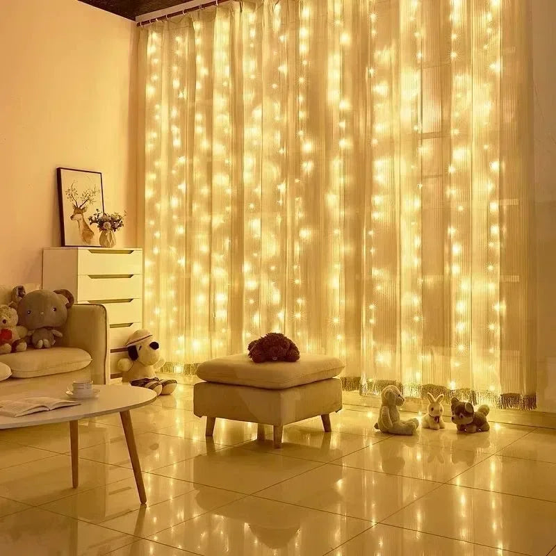 A window decorated with vertical fairy lights creating a warm, glowing curtain effect indoors.