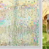 Close-up of a textured frosted window privacy film with iridescent colors and a dog's head visible in the background.