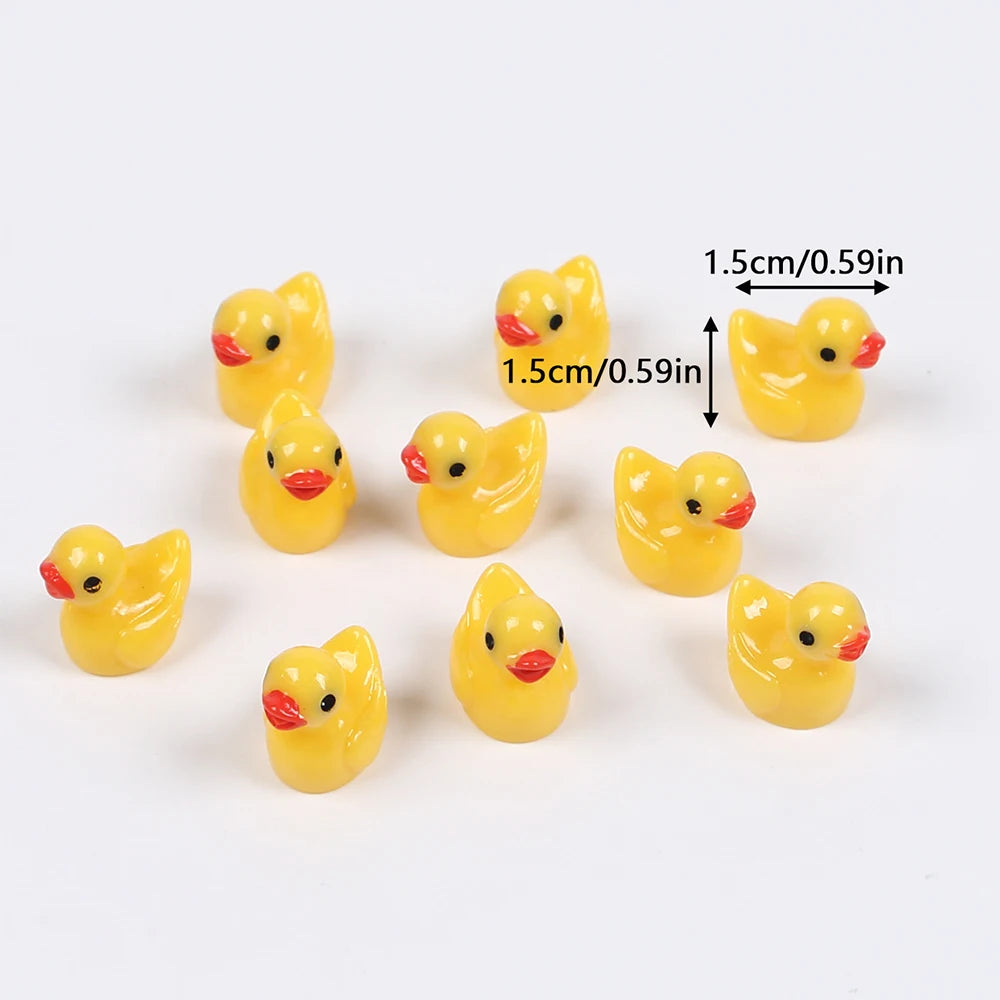 A collection of yellow mini resin duck figurines, measuring 1.5cm or 0.59in.