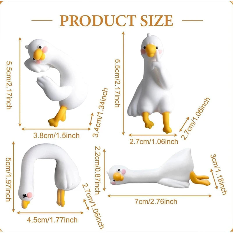 Figurines de canard en résine blanche dans diverses poses et tailles, y compris un canard debout, courbé et allongé.