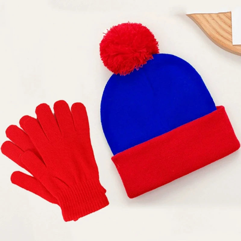 A set of festive knitted winter accessories including a bright red pom-pom beanie and matching red gloves.