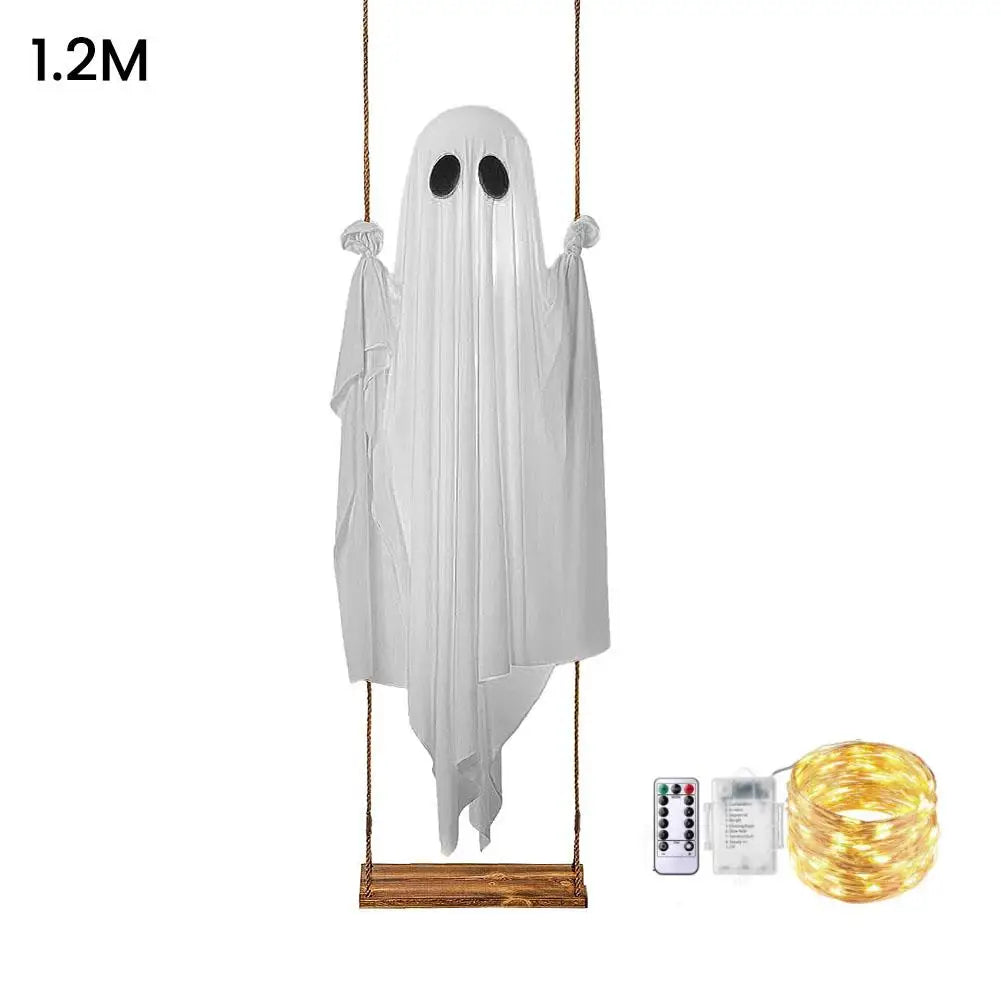 A white ghost decoration hangs from a string with LED lights.
