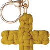 A golden woven cross keychain with a circular split ring attached.