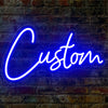 A bright blue neon sign spelling the word Custom is mounted on a brick wall.