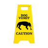 Yellow yard sign with black text warning about dog vomit and caution.