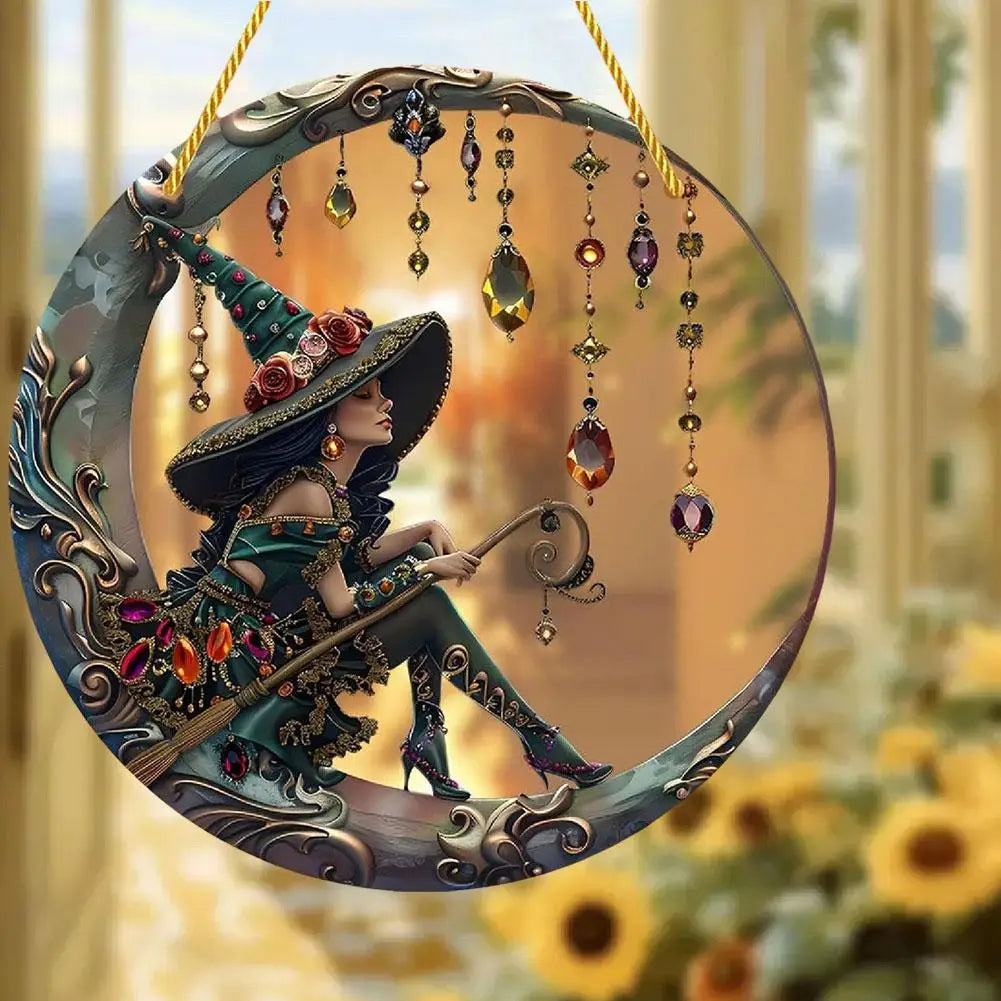 A decorative stained glass window featuring a witch figure in a pointed hat and green dress with hanging jewels.