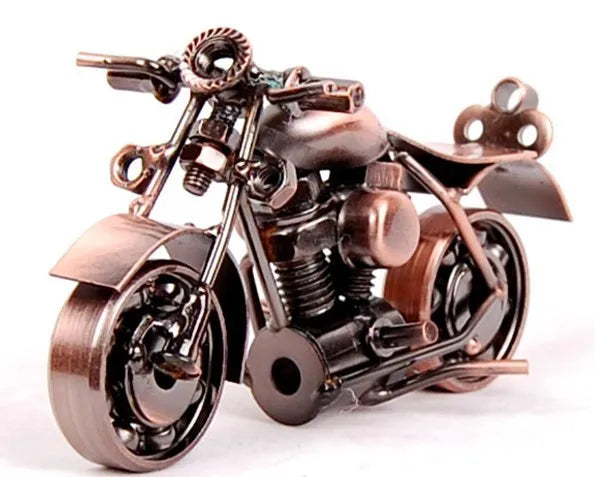 A handcrafted metal motorcycle model with a vintage appearance, featuring dark bronze and black components.