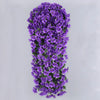 A dense hanging garland of artificial purple violet ivy flowers