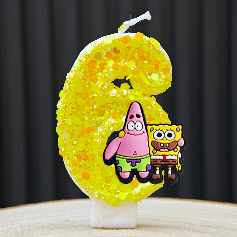 A yellow sponge cake shaped like the number 6, decorated with characters from SpongeBob SquarePants.