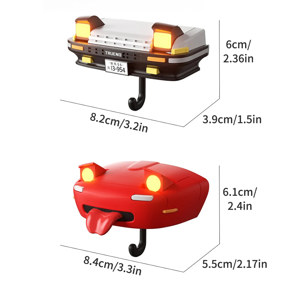 A classic car headlight key holder with LED illumination, shown in black and red colors.