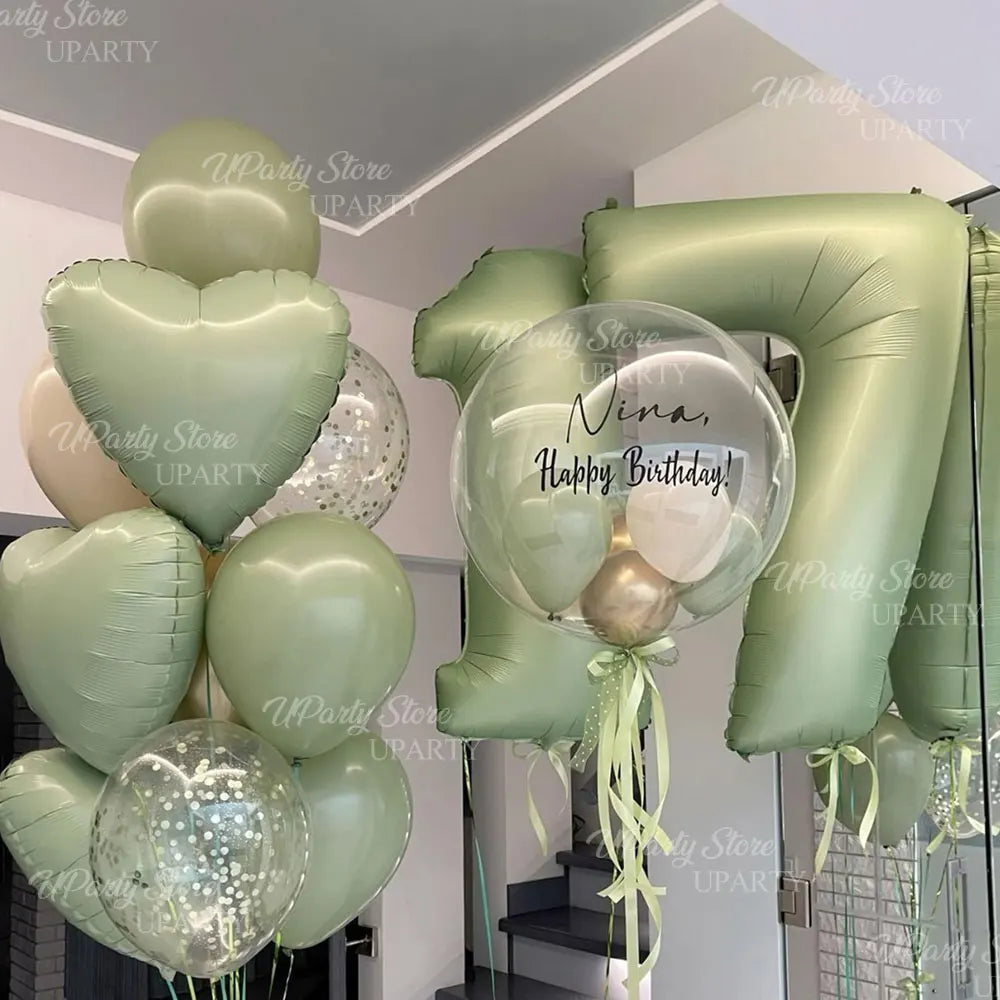 A stack of green and gold foil number balloons shaped like the number 7, celebrating a birthday.