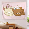 A pink tapestry featuring a cute cartoon bear illustration with pink ears and a white bow.