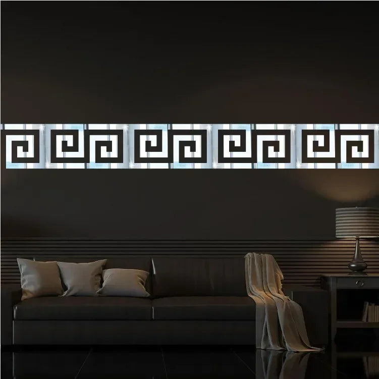 A horizontal acrylic mirror wall sticker set featuring a geometric maze pattern mounted on a dark gray wall.