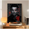 A poster featuring a close-up portrait of Cristiano Ronaldo with red accents, displayed on a wooden table.