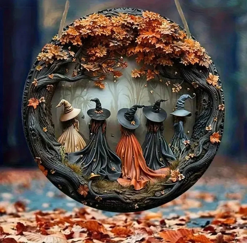 A circular wooden decor sign featuring witches and autumn leaves within a wreath.
