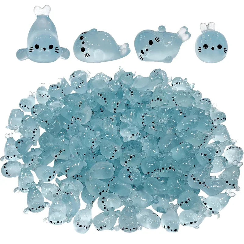 A collection of translucent blue glow in the dark resin sea animal figurines.
