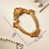 Vintage gold DIY shadow box frame for a 3D memory display with a pearl beaded chain and a flower charm