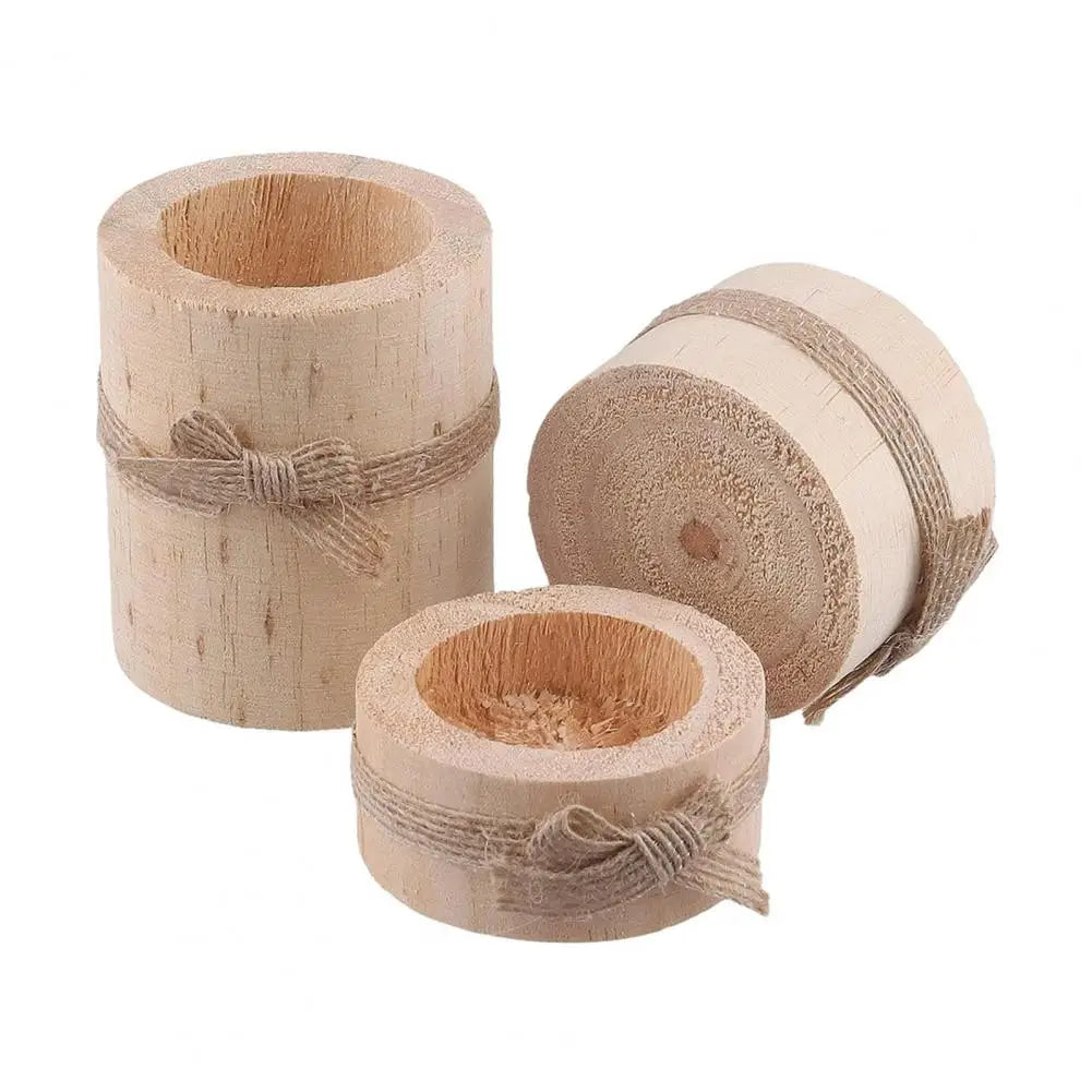 A set of rustic wooden stump candle holders, showing various sizes and textures.