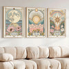 A set of three framed art prints featuring celestial themes like the moon sun and star with floral designs.