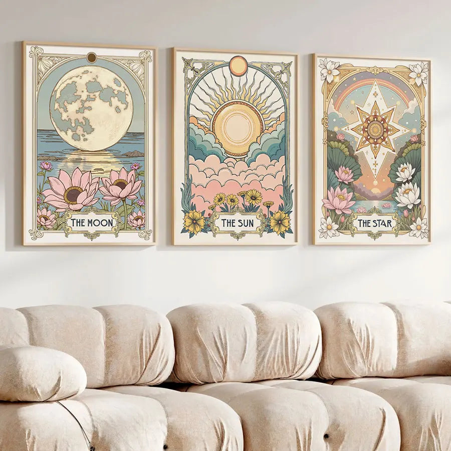 A set of three framed art prints featuring celestial themes like the moon sun and star with floral designs.