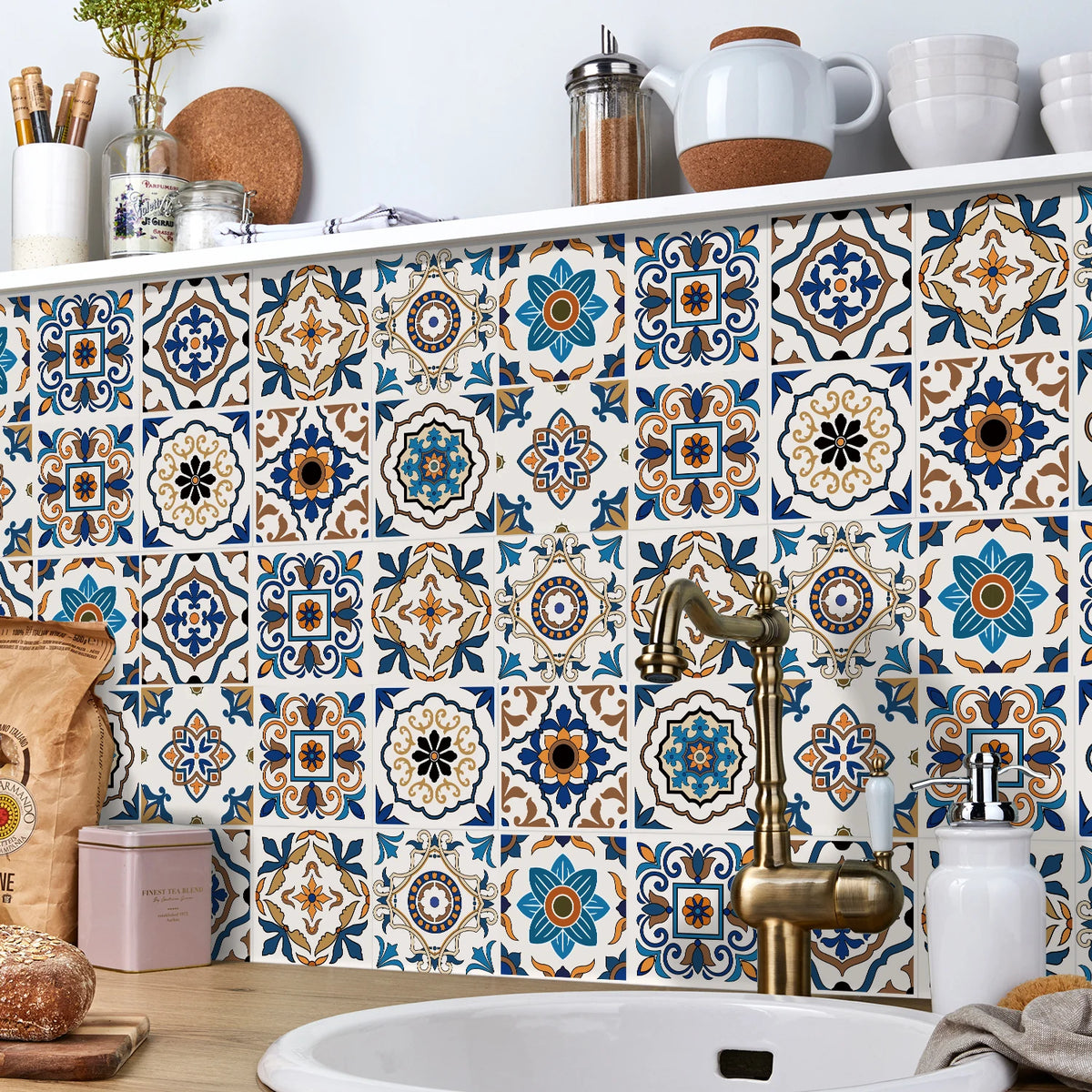 A decorative tile backsplash featuring blue, white, and brown geometric patterns on a kitchen wall.