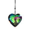 A heart-shaped window pendant made of iridescent, multicolored glass.
