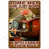 A vintage retro metal wall sign featuring a photo of a boy leaning on a red car with the text Some men are just born with car