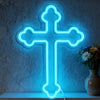 A bright blue neon cross wall sign mounted on a gray textured wall.